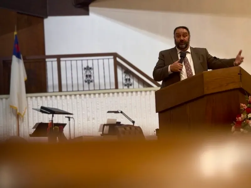 Pastor Paul Coyle at the pulpit.